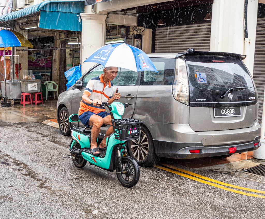 Rainy Morning on Electric Scooter by ianjb21