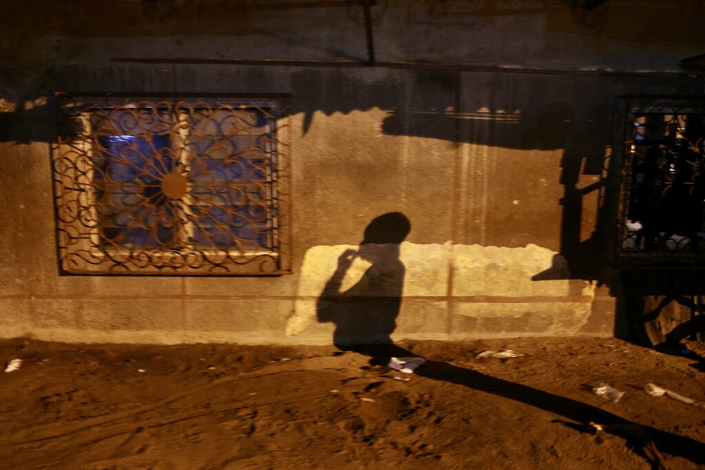 Shadows of Cotonou: A Nocturnal Encounter by vincent24