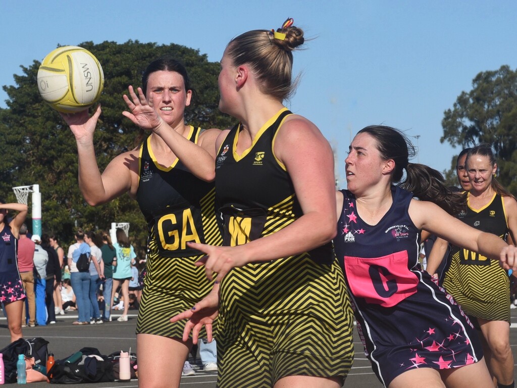 My daughter (left) playing netball for UNSW by johnfalconer