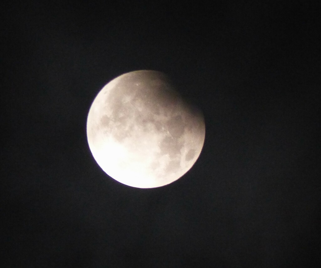 0330... partial  lunar  eclipse,  through the clouds  by jokristina