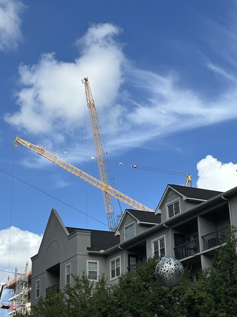 Sky scape of two cranes forming a X. But why? by swagman