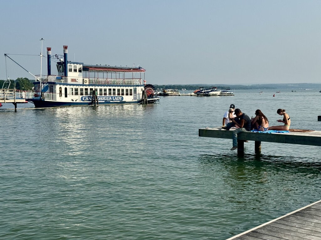 Phone-absorbed on the dock by jbritt