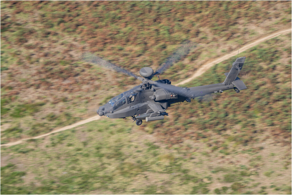 Apache helicopter through the Mach Loop by clifford