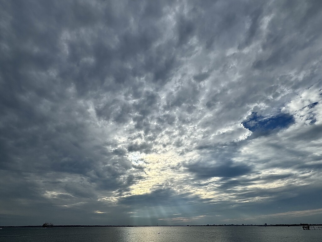 Charleston Harbor light, skies and sunrays by congaree