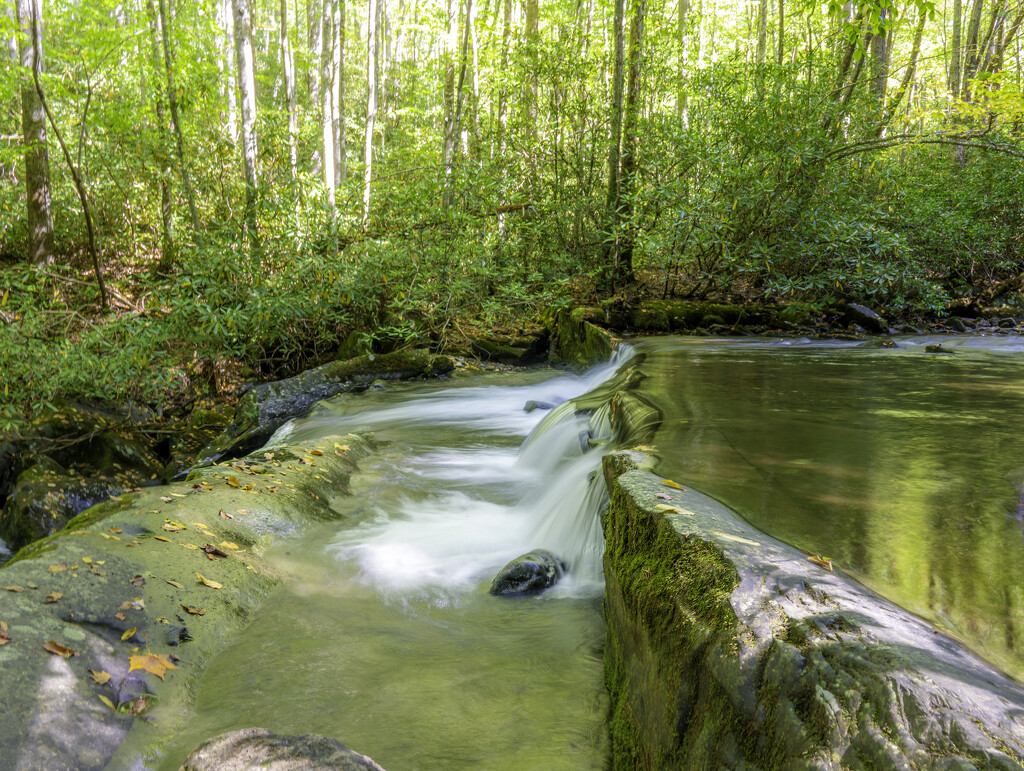 waterflowing on rocks  by myhrhelper