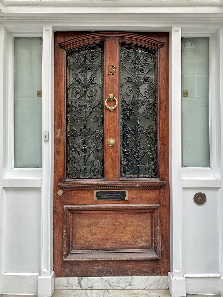 18 hearts on a brown door.  by cocobella