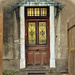 Four hearts on a brown door. 