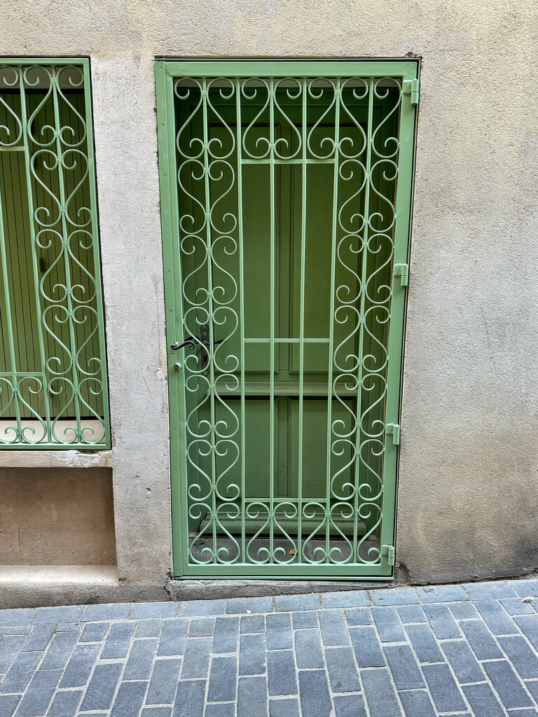 Green door with hearts.  by cocobella