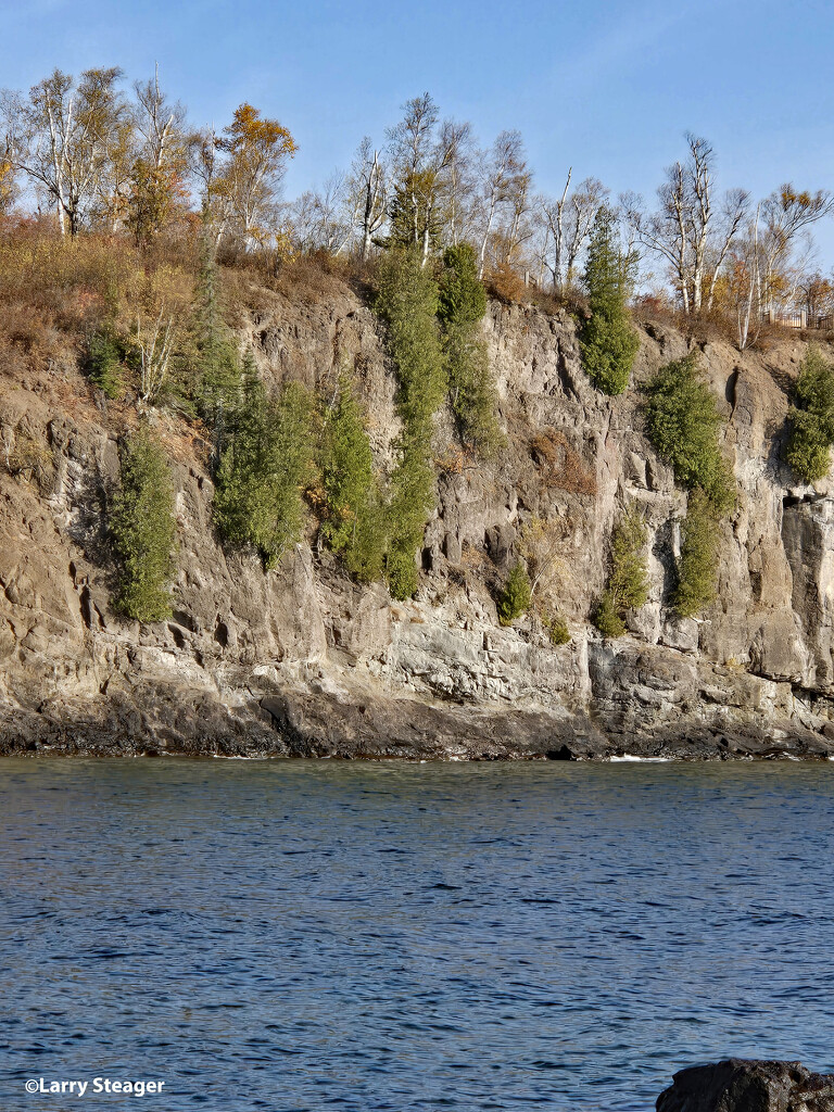 Cliffs along Lake Superior shore line by larrysphotos