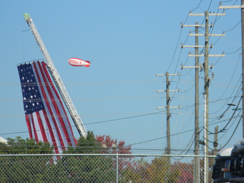 American Flag and Blimp  by sfeldphotos