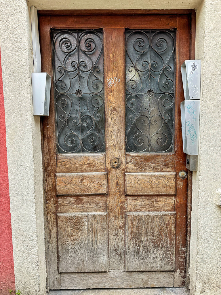 Four hearts on a brown door.  by cocobella