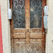 Four hearts on a brown door. 