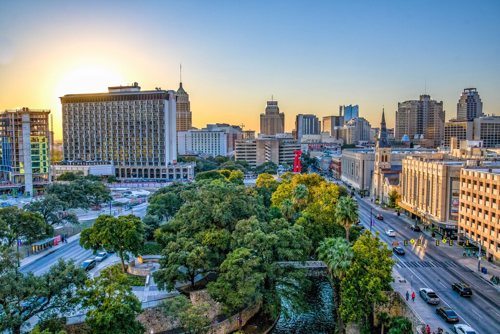 Sun sets over the city by danette