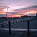 Sun sets over Main St. bridge