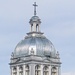 Six windows, a dome, a turret and a cross