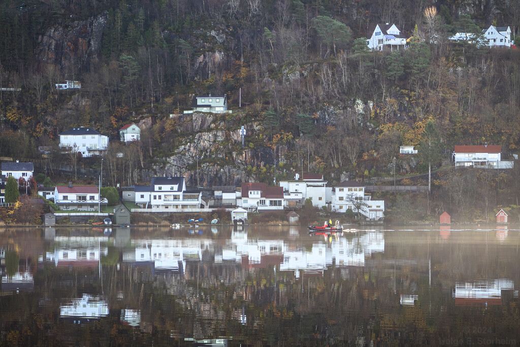 Boat on the lake and houses on the hillside by helstor365