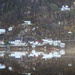 Boat on the lake and houses on the hillside