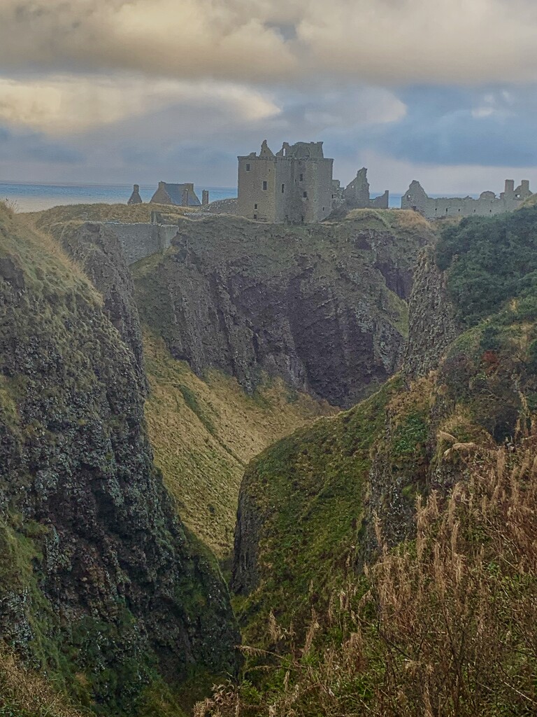 Looking through the gully and mist to Dunnottar Castle by billdavidson