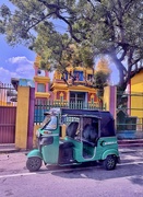 12th Feb 2025 - Green tuktuk and yellow temple. 