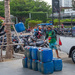 Re-loading the empty petrol containers.