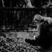 Girl sitting on a wall reading