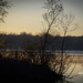 Fisherman sits while waiting for a bite while fishing at dawn