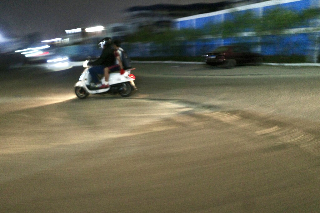 scooter rider at night by vincent24