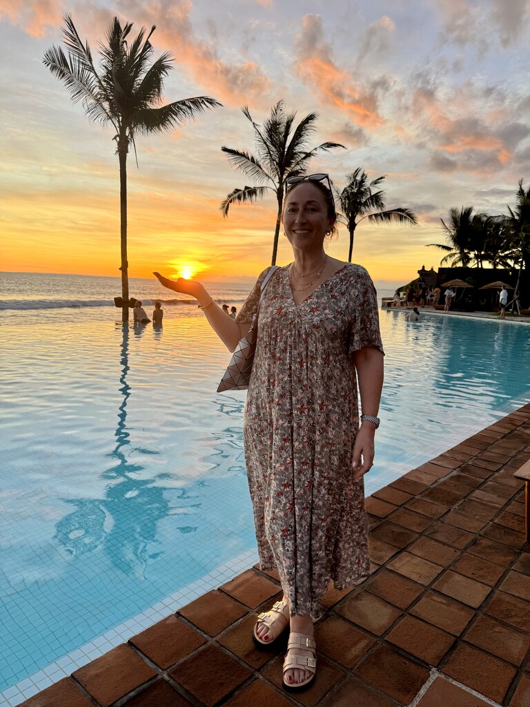Holding the sun.  by cocobella