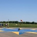 I was amused by this child sitting in what I assume is the helicopter landing site.