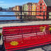 Red bench and the piers by elisasaeter