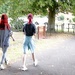 Two young redheads in a hurry