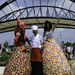 actors on stilts welcome visitors to the fair