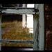 A view through window of an abandoned home  by whippy