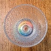 Wine glass on rainbow coaster 