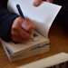 Michael Signing his book